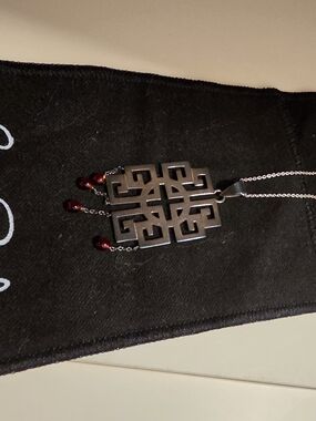 Stylish Black Geometric Pendant Necklace with Red Bead Accents